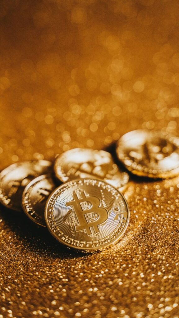 A Phone wallpaper featuring bitcoins with golden background symbolizing Financial abundance.